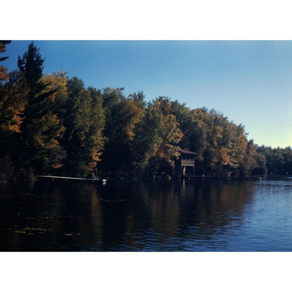 Kodak Slide 35mm 1940s Red Border,  a serene lake surrounded by a lush forest